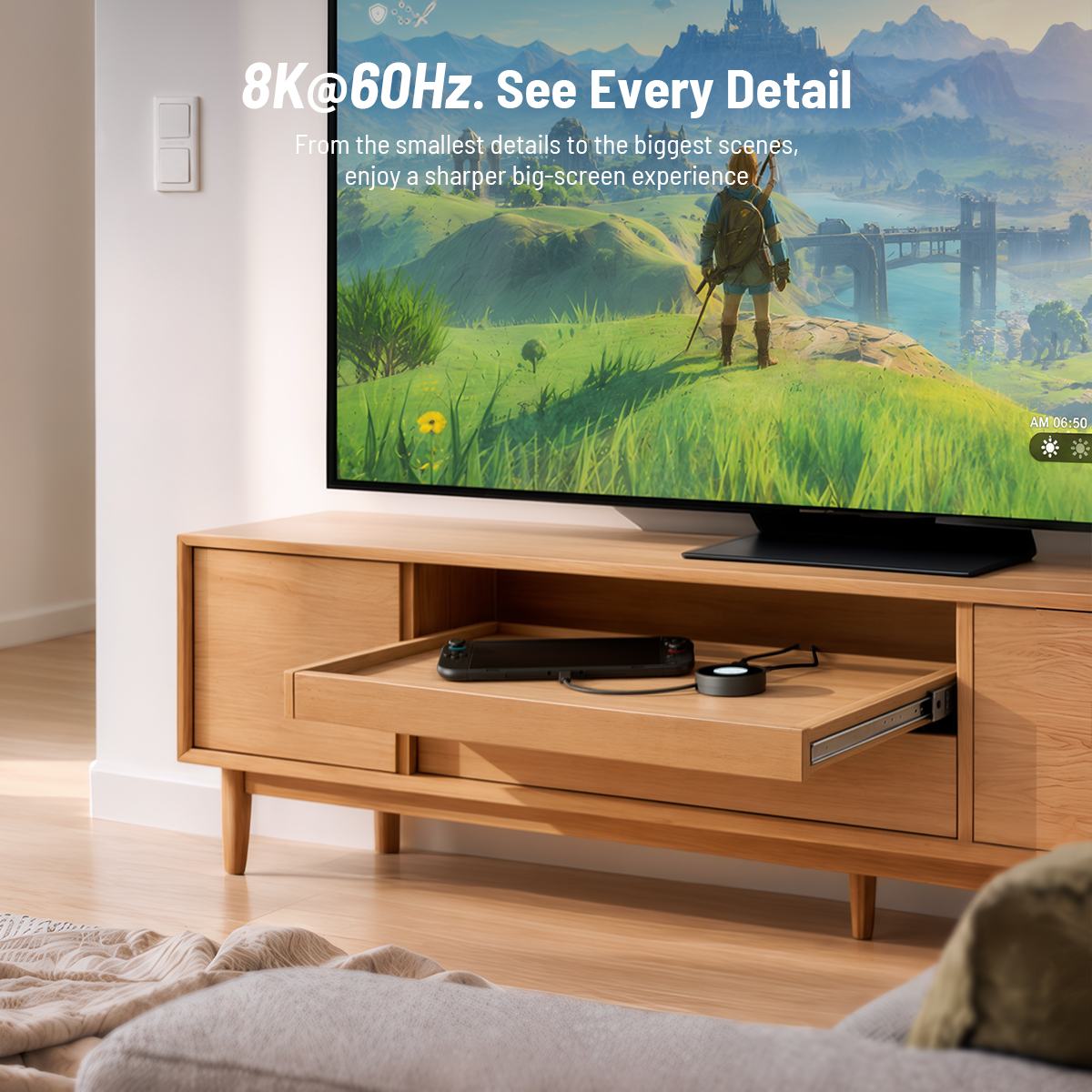 Antank S6 black portable hub in wooden cabinet drawer, handheld game console outputs gameplay to large TV screen